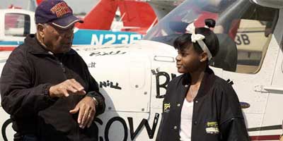 tuskegee-kim-n-levi-web Tuskegee Airman Levi Thornhill and teen-age pilot Kimberley Anyadike talk about flying.
