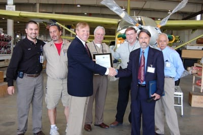 Left to right-back row: Chad Bryan (Quest Aircraft), Danny Hiner (Quest Aircraft), Ron Wright (Quest Aircraft), Tom Willis (Quest Aircraft), Manny Lopez (MIDO). Front Row: Paul Schaller (Quest CEO) and Tim Veranna (Manager, Seattle MIDO).