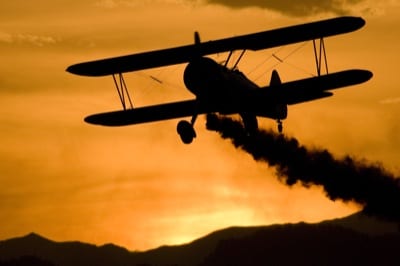 Colorado Gary Rower flying a Stearman biplane in the 2009 Twilight Air Show. Photo by Ben Remy.