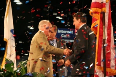 AT THE RALLY: Jim Coyne, NATA president, shakes West Virginia Gov. Joe Manchin's hand at the GA Serves America Rally. AOPA President Craig Fuller is in the background.