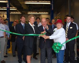 Cutting the ribbon are (L to R) Joie Alexander, John Johnson, and Patricia Northey.