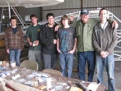 Working on the restoration of Stits Skycoupe are (left to right) Leland Spearman, Alex Lemke, Nathan Sandoval, Christian Krause, Al Gester, and Jonathan Lane. Not shown are Kyle Appleberry and Jacob Hilger.
