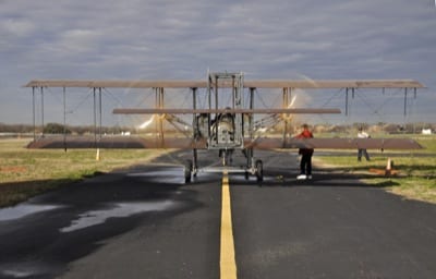100301WBF-013 Don Stroud and Rich Stepler fire up Wright "B" Flyer No. 001 for its test flight at Stinson Airport in San Antonio, TX in preparation for tomorrow's Military Flight Centennial. WBF Operations Director Phil Beaudoin is in red jacket; crew chief Joe Tyler at right.