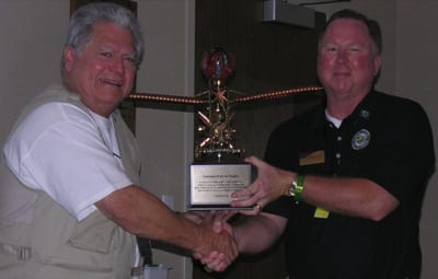 LAMA Tom Gunnarson (right), outgoing LAMA president, created the new Burke Trophy and is seen here presented the permanent trophy to Larry Burke. Burke Trophy recipients will receive a plaque.