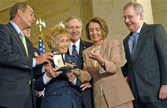 wasp Deanie Parrish, one of the World War II Women Airforce Service Pilots and associate director of Wings Across America, accepts the Congressional Gold Medal on behalf of her fellow WASPs at the Capitol March 10, 2010. Presenting the medal are Speaker Nancy Pelosi, Rep. John Boehner, Sen. Harry Reid and Sen. Mitch McConnell. More than 200 WASPs attended the event, many of them wearing their World War II-era uniforms. (U.S. Air Force photo/Staff Sgt. J.G. Buzanowski)