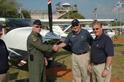 (L to R) Florida Wing Commander Col. Chris Moersch with Civil Air Patrol with Cessna's John Doman and Chairman, President and CEO Jack Pelton at Sun 'n Fun