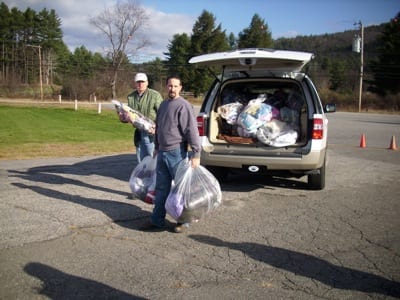 General aviation pilots from New Hampshire recently answered the call of duty by flying their own planes loaded with relief supplies to storm-ravaged parts of New York and New Jersey.  Shown here are Terry Callum, left, and Heath Marsden, Parlin Field airport manager, as the two prepare to load donated supplies into several small aircraft.  In total New Hampshire pilots flew 2,500 pounds of supplies to victims of Hurricane Sandy. 