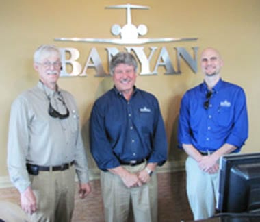 Sam Lyons, Don Campion, and George Tucker, who manages the pilot shop