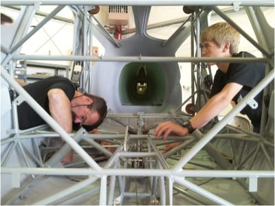 Mark Van Tine (left) works with a student on the Sportsman.