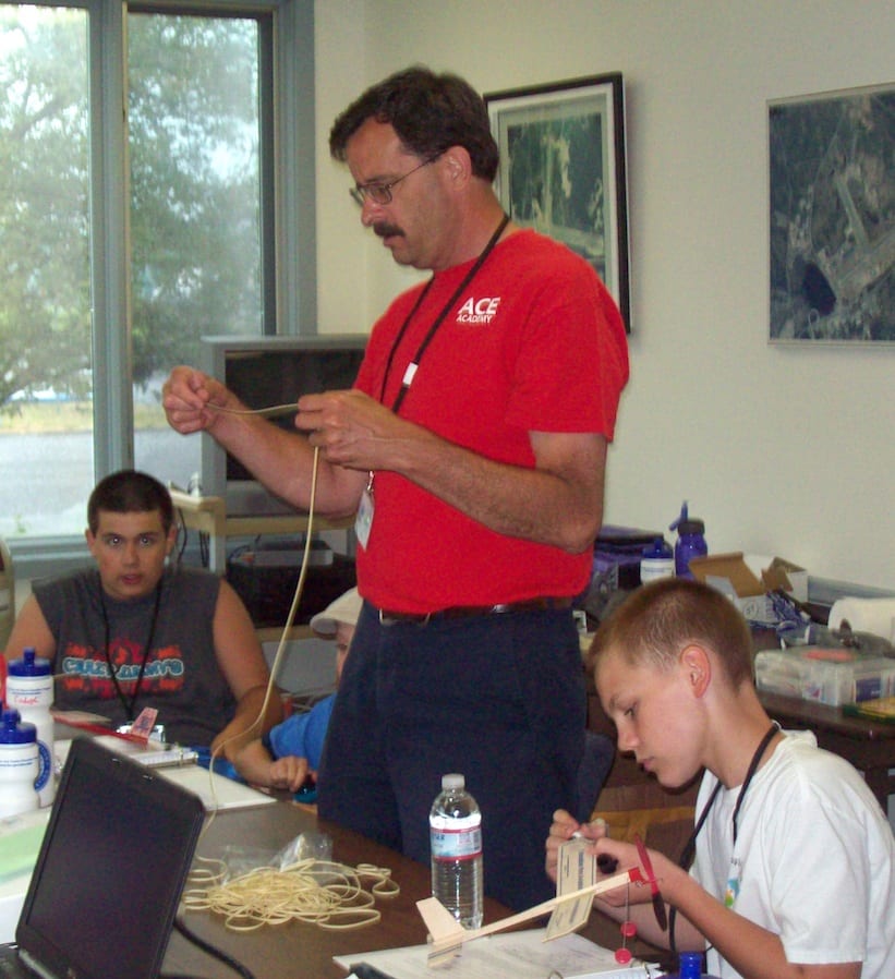 Photo Caption: Teacher Dan Caron works with Laconia Municipal Airport’s ACE Academy students as they learn about aviation and technology. Caron has been chosen as the 2013 Civil Air Patrol Teacher of the Year.